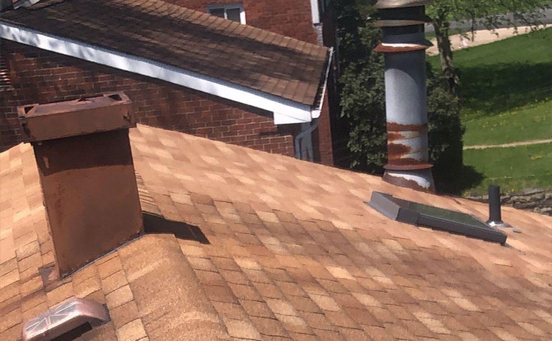 A Plus Renovations roofing crew on the job
