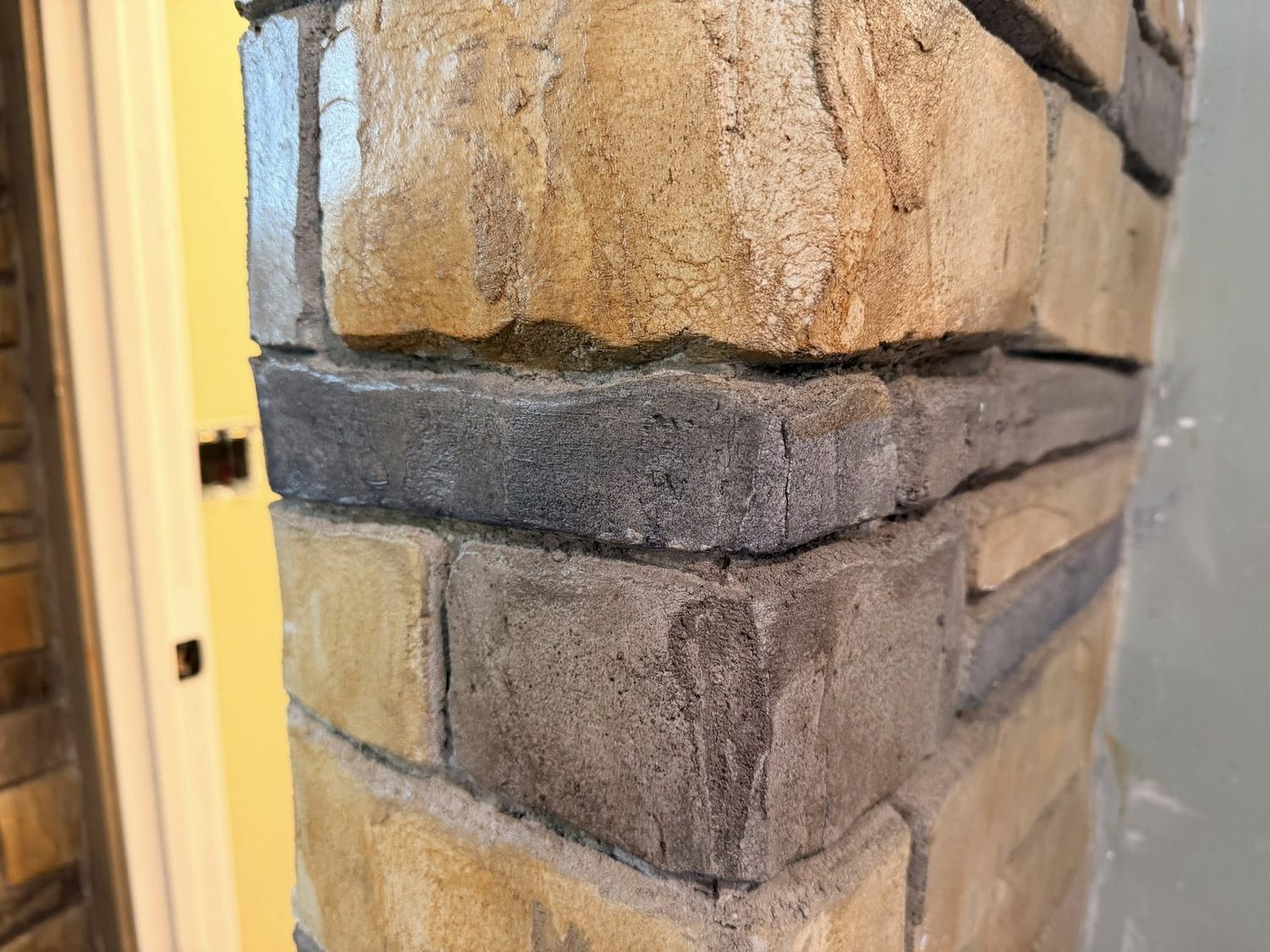 Hand-finished decorative stone overlay detail